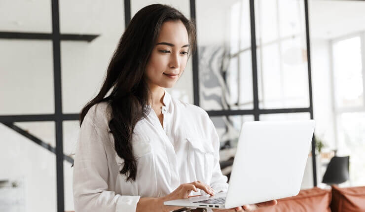 woman typing on laptop