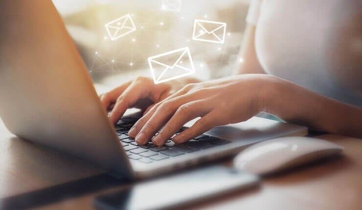 woman typing on laptop