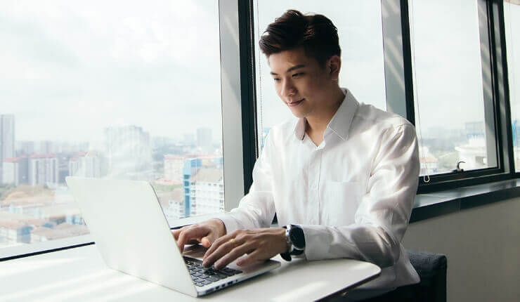 Man typing on laptop