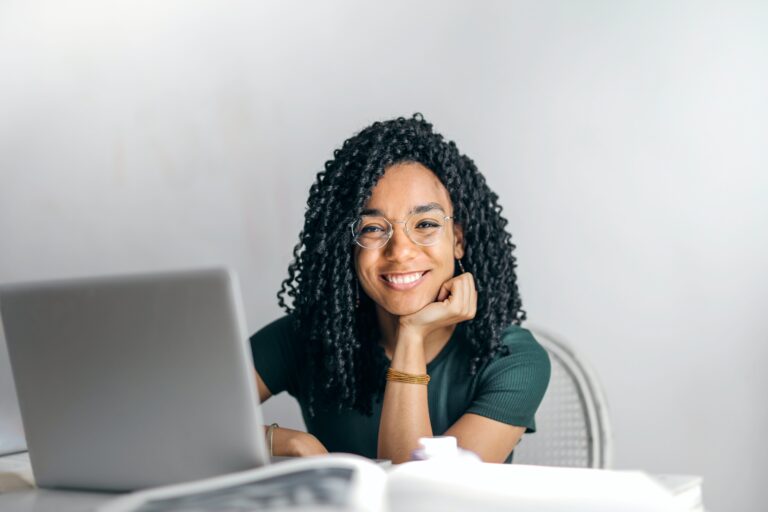 An image of a woman at her computer, faxing documents to the IRS.