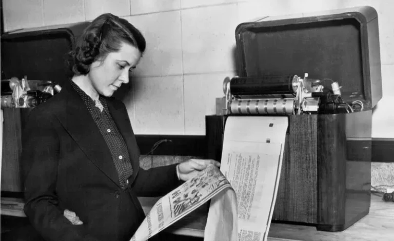An image of a woman receiving a fax in 1943.
