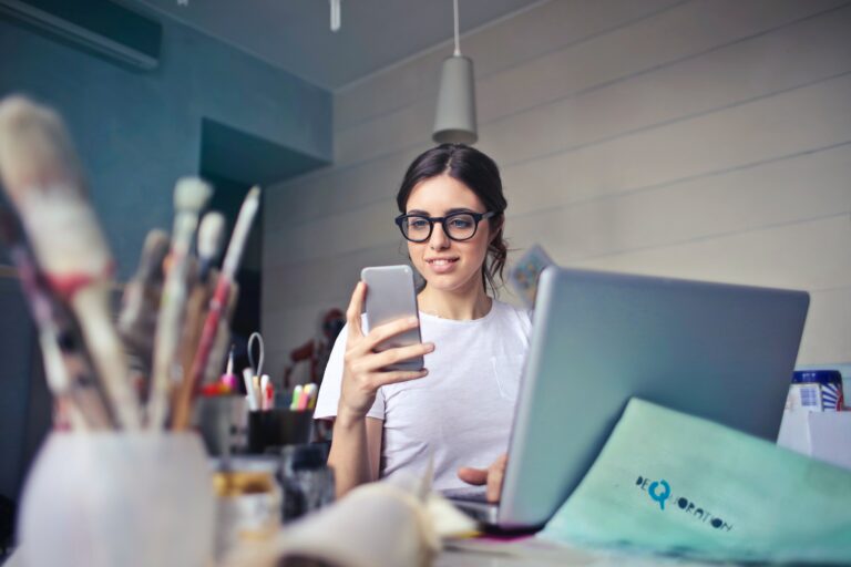 An image of a woman setting up a fax number with MetroFax through a mobile phone.